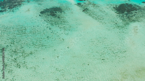 Turquoise lagoon surface on atoll and coral reef, copy space for text. Top view transparent turquoise ocean water surface. background texture
