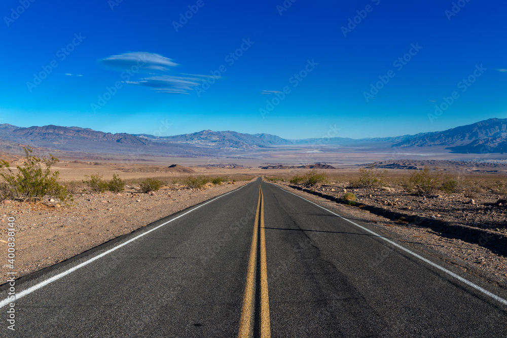 View of an empty road leading to the Death Valley, in California, USA. View of an empty road leading to the Death Valley, in California, USA.