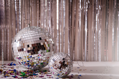 Festive background. disco ball on beige and silver background