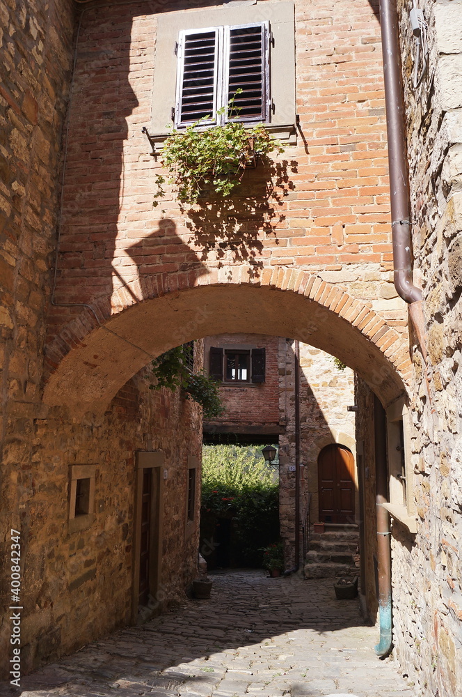 Typical alley in the ancient medieval village of Montefioralle, Tuscany, Italy
