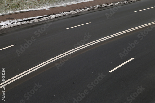 The asphalt roadway with markings