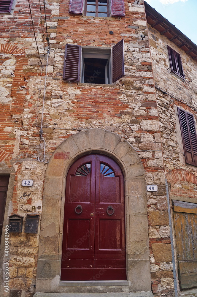 Entrance door of a house in the ancient medieval village of Montefioralle, Tuscany, Italy