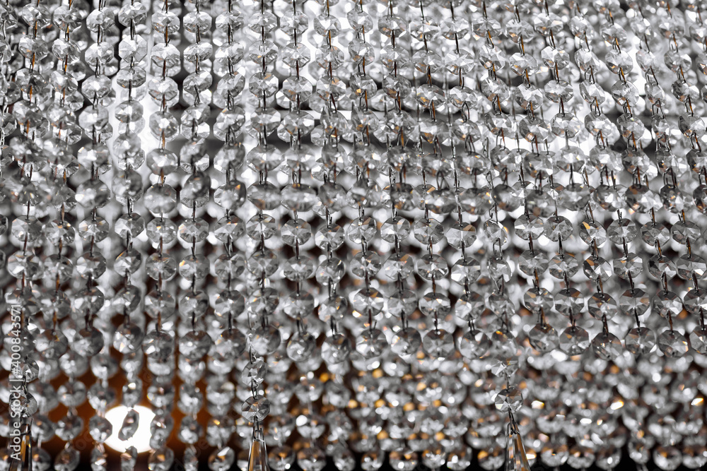 Fototapeta premium background with crystal chandeliers. Crystal chandelier close-up. Glamour background with copy space