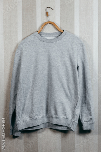 sweatshirt blue color mock up template front view on hanging on wooden hanger  © andrew_shots