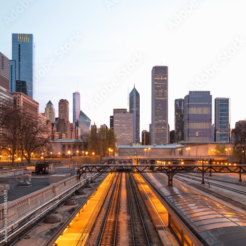 Illuminated railway tracks against buildings in city Chicago, USA photo
