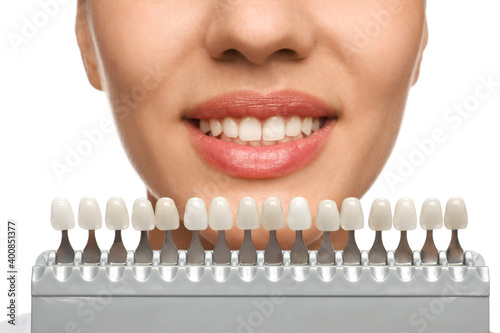 Woman checking her teeth color on white background, closeup. Cosmetic dentistry