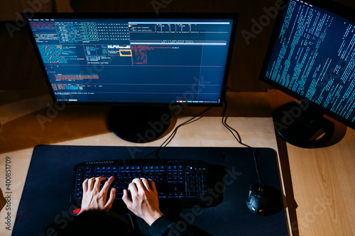 Hacker hands working on computer at office