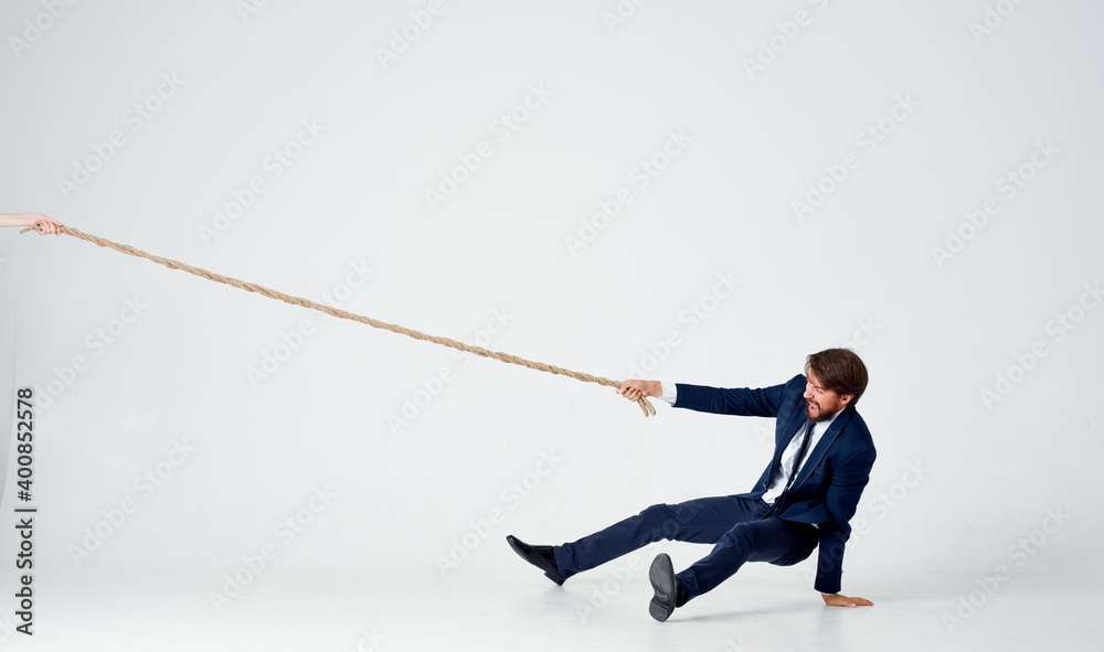 man with rope in hand on light background business finance man with rope in hand on light background business finance