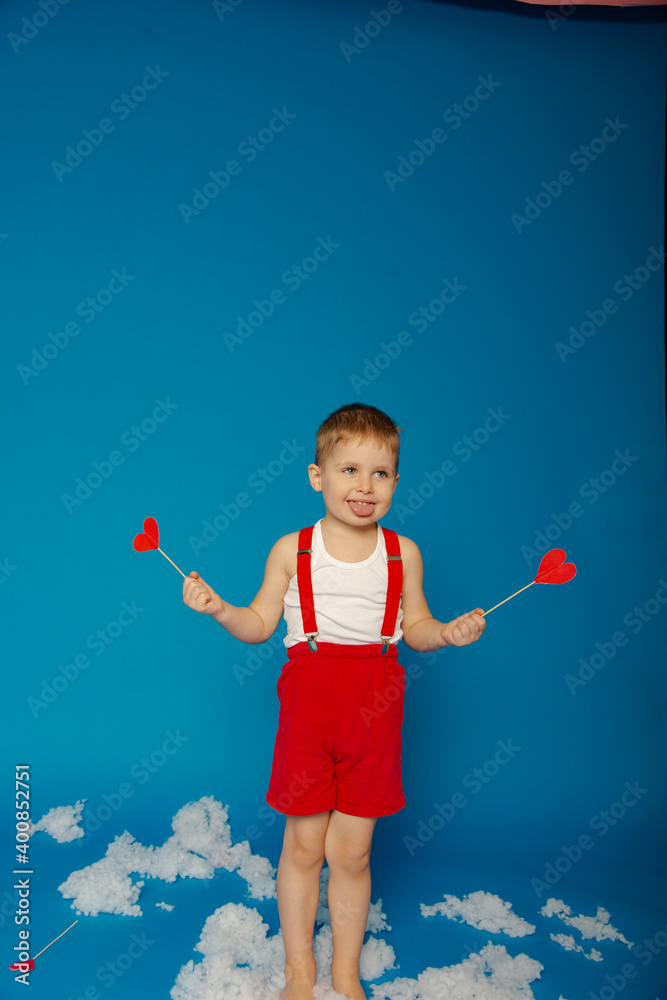 Little cute boy in red suspenders on Valentine's Day Little cute boy in red suspenders on Valentine's Day