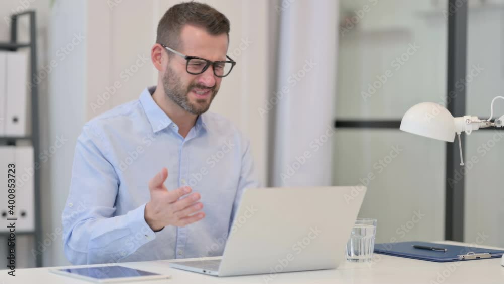 Middle Aged Man Reacting to Failure while using Laptop at Work Middle Aged Man Reacting to Failure while using Laptop at Work