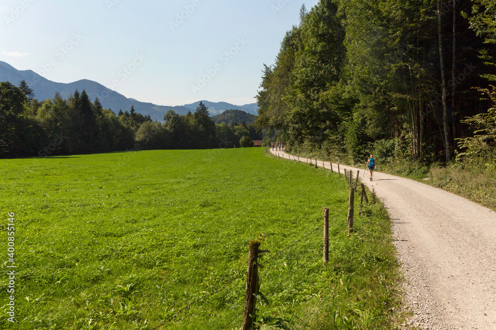 Dirt road stretching along empty pasture in summer Dirt road stretching along empty pasture in summer