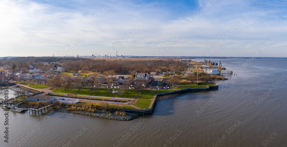 Aerial view of Delaware City New Castle County, Delaware, United States. Small port town on the eastern terminus of the Chesapeake and Delaware Canal with an oil refinery in the background