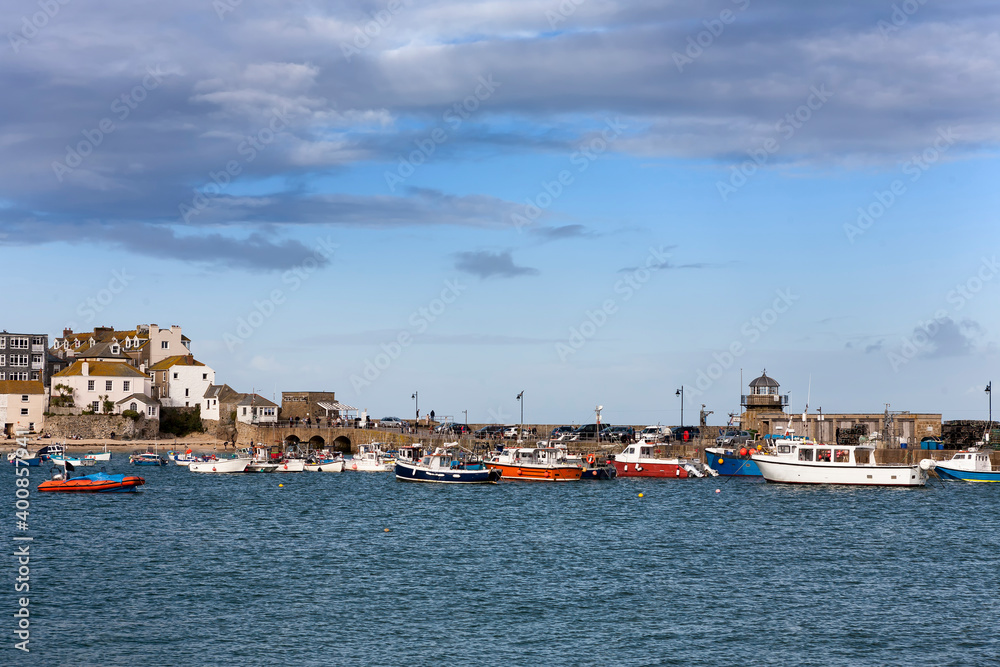 St. Ives' harbour and Smeaton's Pier at high tide from Wharf Road, St Ives, Cornwall, UK
