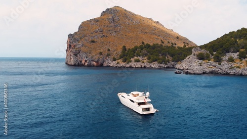 Sa Calobra, Torrent De Pareis beach with turquoise sea water and moored sailing boats in crystal clear blue waters, Serra De Tramuntana aerial. High quality photo