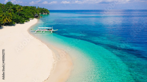 Fototapeta Naklejka Na Ścianę i Meble -  Tropical island with a white beach. Mahaba Island, Philippines.