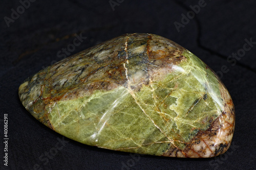 A polished sample of unakite (granite with epidote). Russia
 photo
