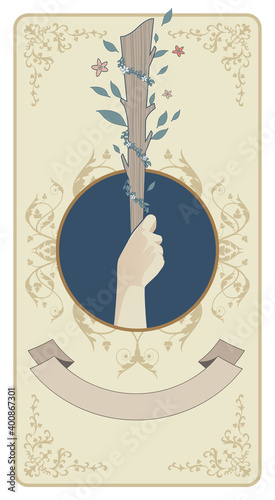 Aces of Tarot Cards. Wands. Hand holding a rod surrounded by leaves and flowers on sun and green field in the background