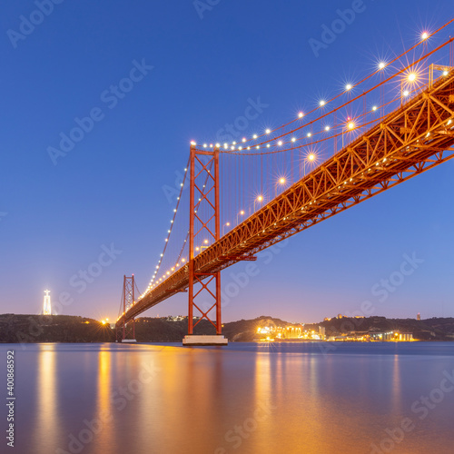 Portugal, Lisbon District, Lisbon, 25 de Abril Bridge at dusk photo