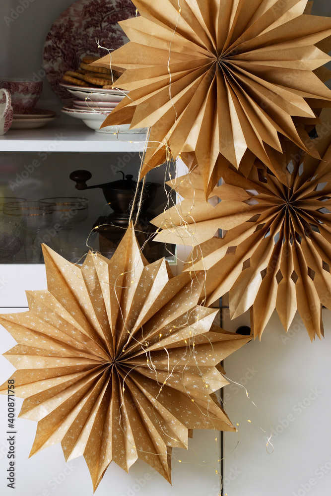 Paper Christmas stars made from craft bags.