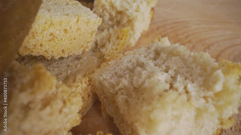 Croutons close-up. Slices of rusks on a white wooden background Croutons close-up. Slices of rusks on a white wooden background