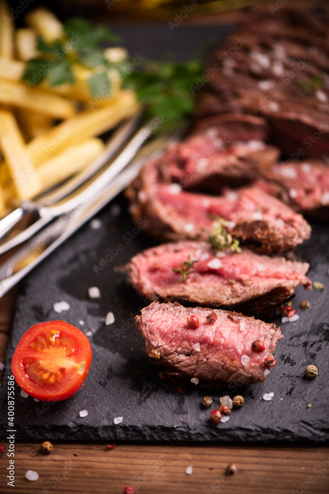Sliced grilled medium rare beef steak