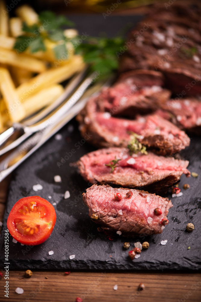 Sliced grilled medium rare beef steak Sliced grilled medium rare beef steak