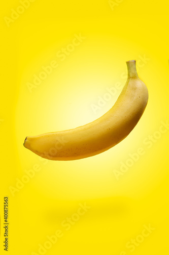 banana fruit flying on yellow background