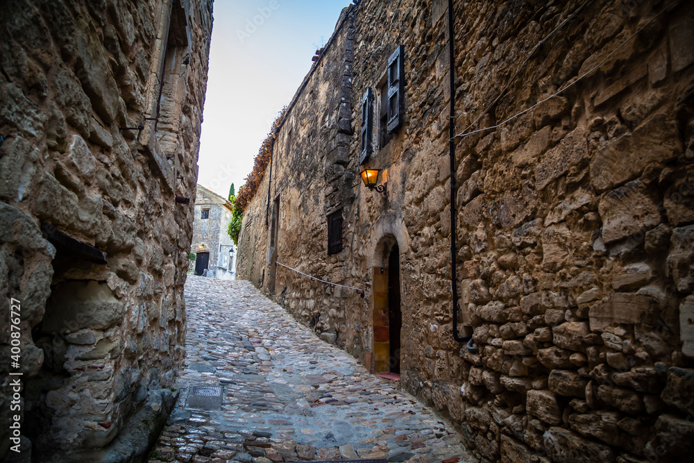 Old houses in the streets of the ancient village Lacoste in Provence, France Old houses in the streets of the ancient village Lacoste in Provence, France
