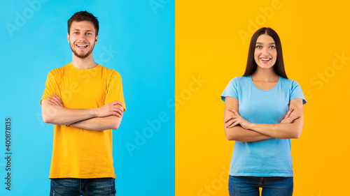 Obraz na plátně Smiling confident couple posing with folded arms on studio background