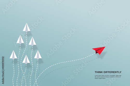 Think differently concept. Red airplane changing direction. Concepts: change, unique, trend, courage, innovation, different.