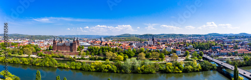 Germany, Bavaria, Aschaffenburg, Helicopter panorama of riverside town in summer photo