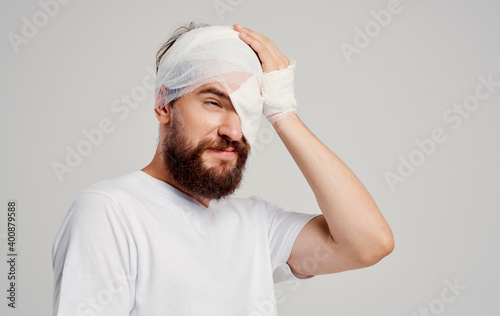 male patient with bandaged head injury health problems hospitalization