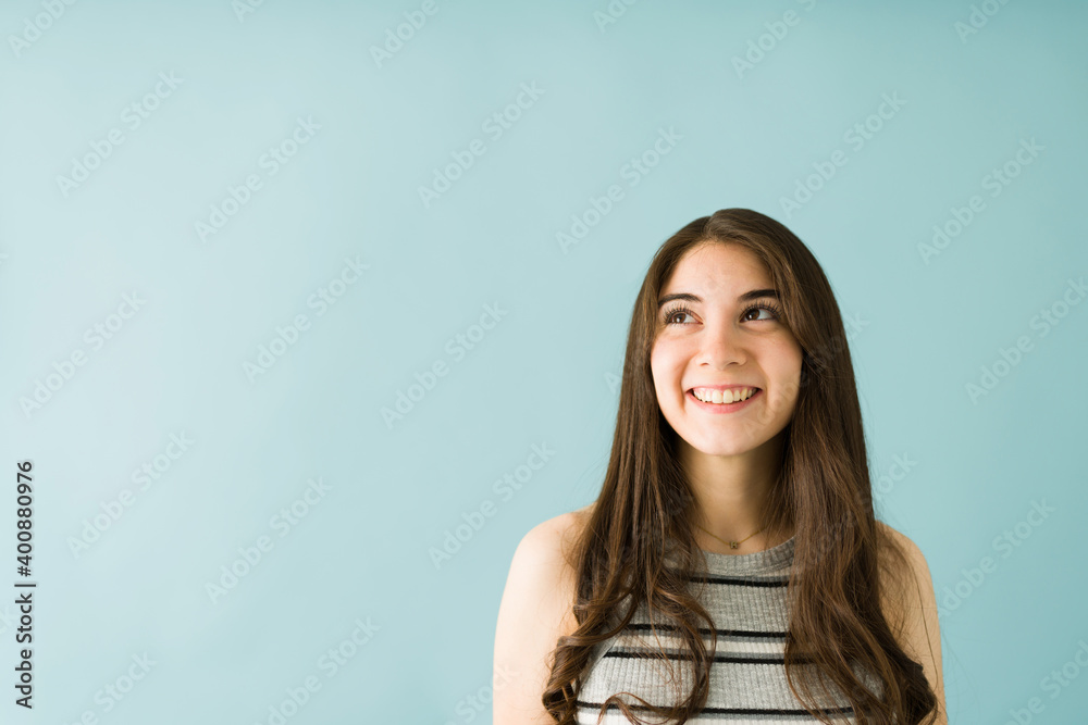 Positive young woman is thinking and remembering good times Positive young woman is thinking and remembering good times