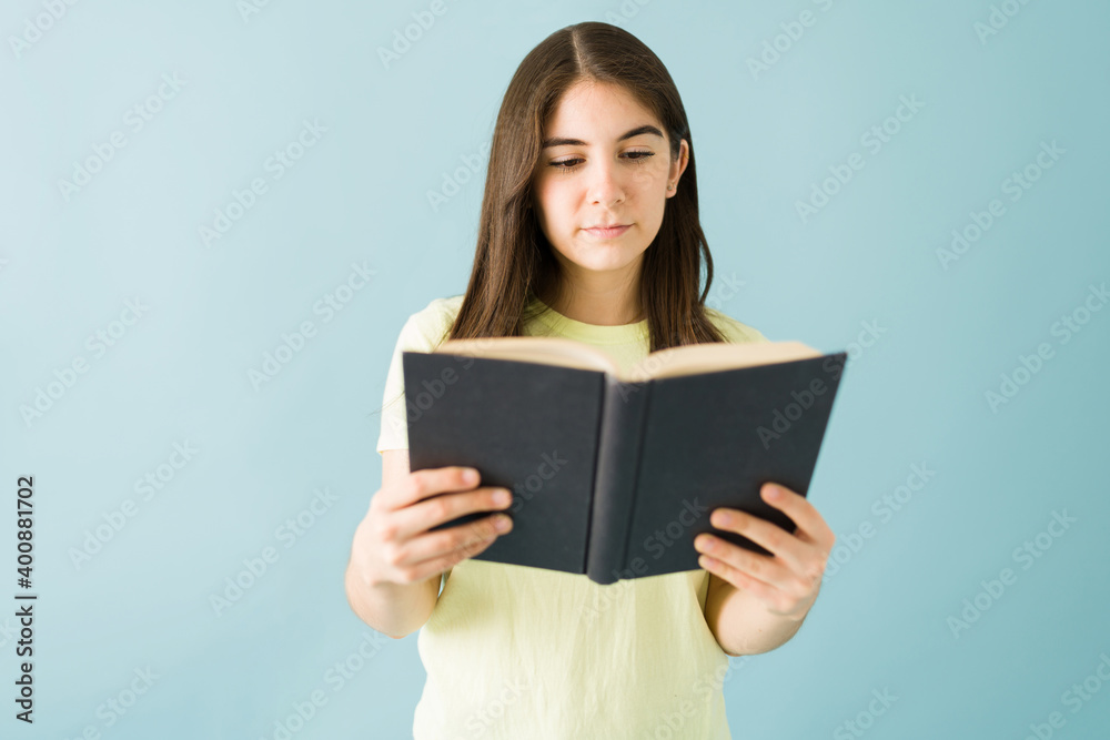 Good-looking woman concentrated on reading a book Good-looking woman concentrated on reading a book