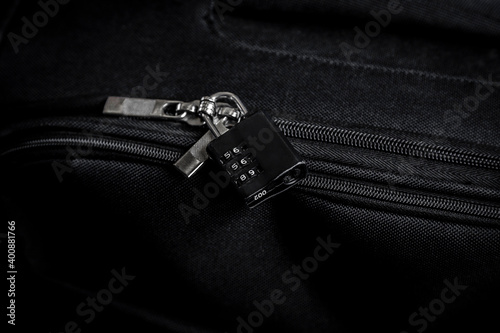 TSA lock on black bag photo