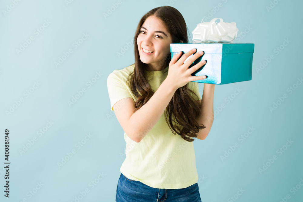 Caucasian woman is about to open a present she received