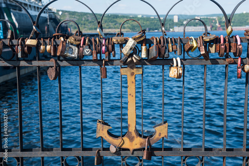 Russia, Murmansk, Love locks and anchor on bridge photo