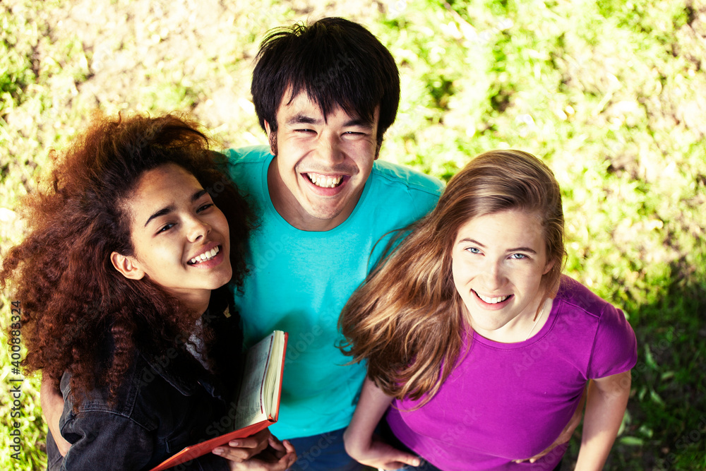 cute group of teenages at the building of university with books huggings, diversity nations, having lunch cute group of teenages at the building of university with books huggings, diversity nations, having lunch