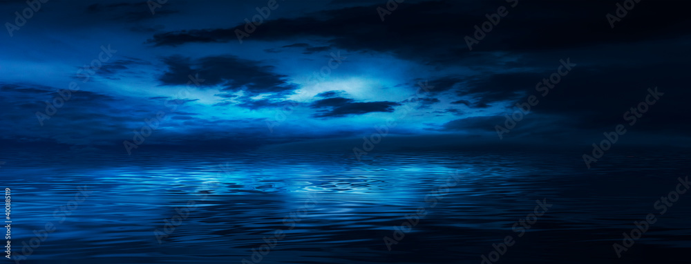 Night sky, horizon at sunset, moonlight, clouds, waves reflected in water. Empty sea landscape, natural scene. Night view.