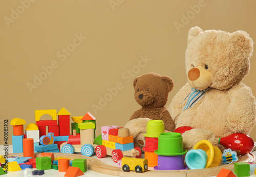 Colorful cildren's toys on table, wooden, plastic and plush toys © triocean
