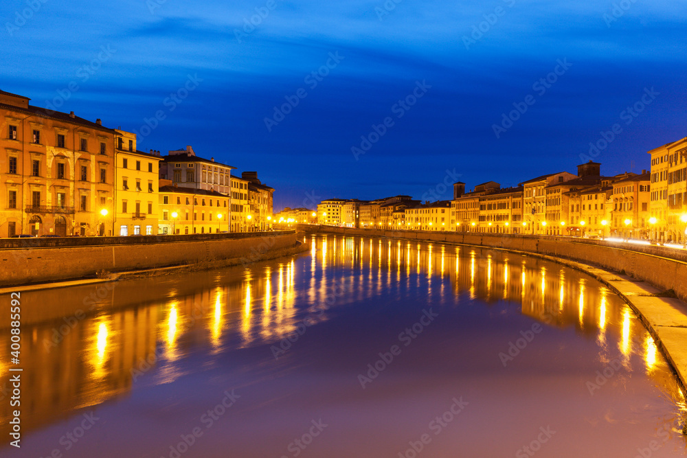 Illuminated townhouses by Arno river at night Illuminated townhouses by Arno river at night