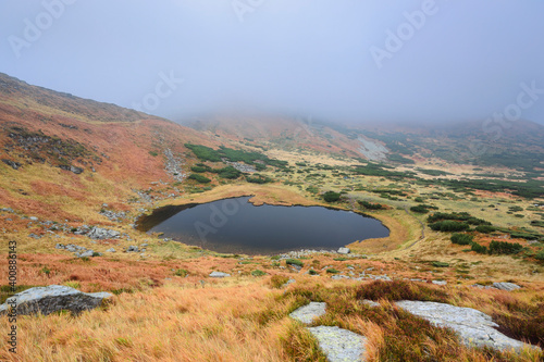 Lake Nesamovyte in fogy landscape photo