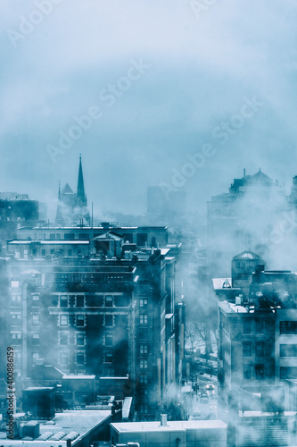 Steam above buildings in winter photo