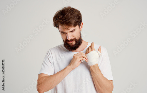 man with bandaged arm traumatology treatment health problems