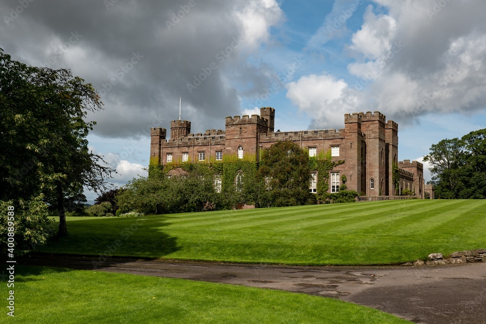 Scone Palace, red sandstone brick castle in Perthshire, Scotland at nice sunny summer weather Scone Palace, red sandstone brick castle in Perthshire, Scotland at nice sunny summer weather