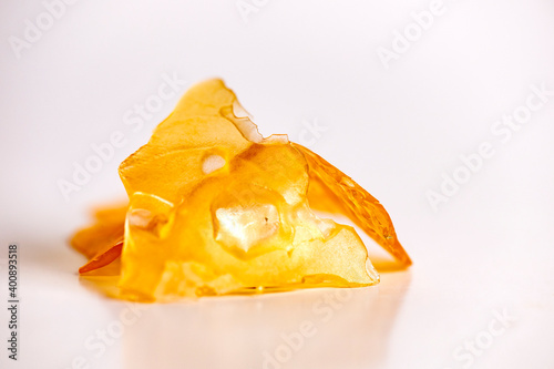 Cannabis oil concentrate aka shatter isolated over white