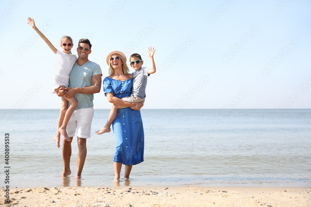 Happy family at beach on sunny summer day Happy family at beach on sunny summer day