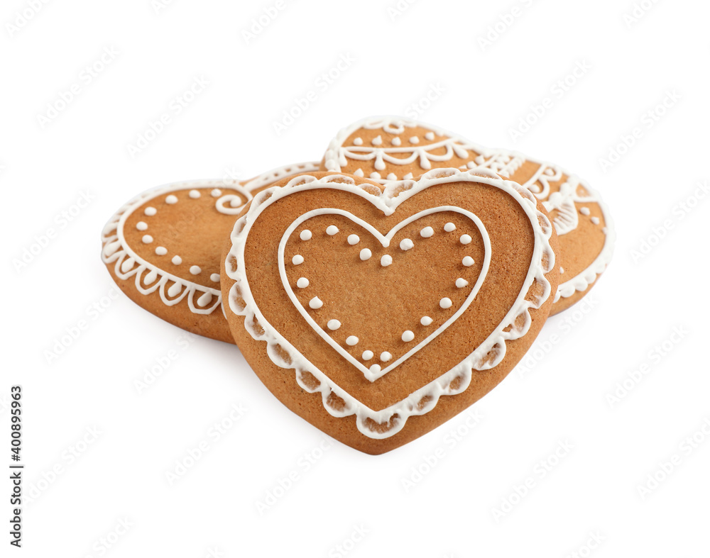 Gingerbread hearts decorated with icing on white background Gingerbread hearts decorated with icing on white background