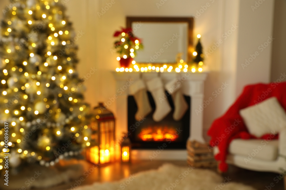 Blurred view of fireplace in living room decorated for Christmas Blurred view of fireplace in living room decorated for Christmas