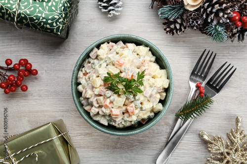Принти на полотні Flat lay composition with traditional russian salad Olivier on white wooden tabl